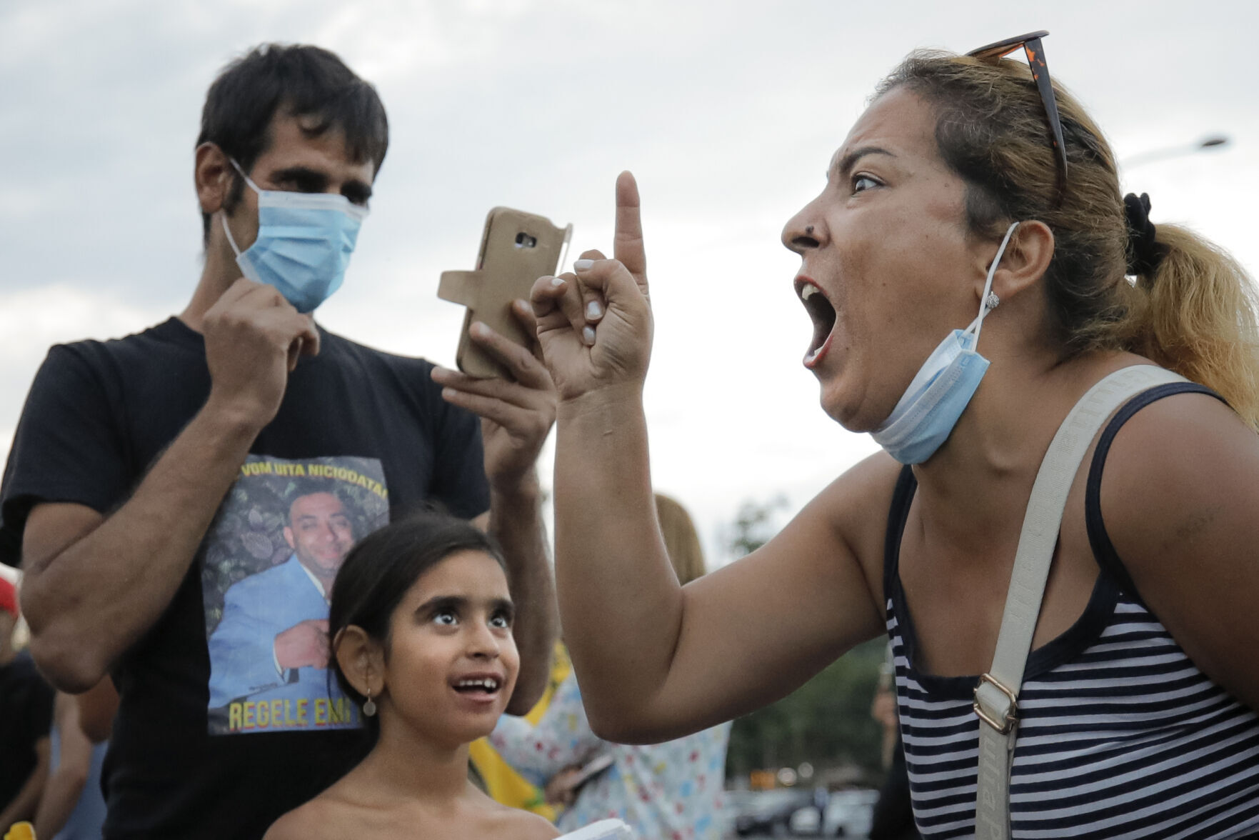 APTOPIX Virus Outbreak Romania QAnon